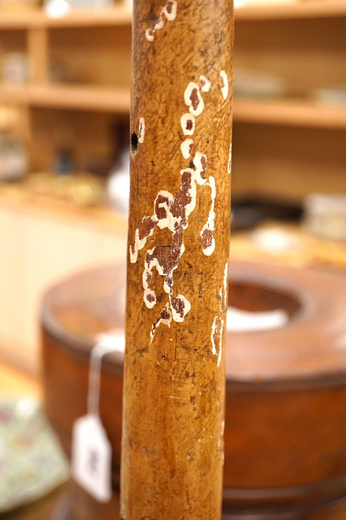 A brass ‘oil lamp’ lamp base and a polychrome painted wood pillar, 75cm